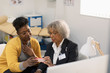 © Tom Merton/Caia Image - Female doctor prescribing medication to patient in doctors office