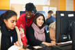 © Himalayan Pics/Caia Image - Female college students using computers in computer lab