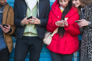 Young adults using smart phones