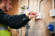 © Himalayan Pics/Caia Image - Male electrician student practicing in workshop