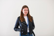 © Himalayan Pics/Caia Image - Portrait confident young woman wearing leather jacket