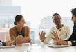 © Tom Merton/Caia Image - Business people talking in conference room meeting