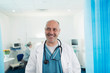 © Sam Edwards/Caia Image - Portrait confident, smiling male doctor in hospital room