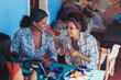 © Trevor Adeline/Caia Image - Happy mother and daughter enjoying lunch on restaurant patio