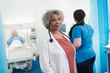 © Sam Edwards/Caia Image - Portrait confident female senior doctor in hospital room