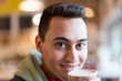 © Tom Merton/Caia Image - Close up portrait confident young man drinking coffee