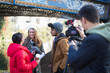© Tom Merton/Caia Image - Young film students filming under urban bridge