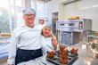 © Trevor Adeline/Caia Image - Portrait happy young students with Down Syndrome in baking class