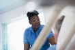 © Sam Edwards/Caia Image - Caring female nurse talking with patient resting in hospital bed