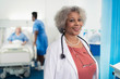 © Sam Edwards/Caia Image - Portrait confident senior female doctor in hospital room