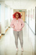 © Himalayan Pics/Caia Image - Portrait confident teenage girl in high school corridor
