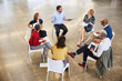 © Ryan Lees/Caia Image - Business people talking in circle meeting