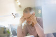 © Tom Merton/Caia Image - Serious businessman talking on telephone in office