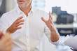 © Ryan Lees/Caia Image - Businessman gesturing in meeting