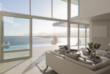 Sunny, Tranquil Modern Luxury Home Showcase Interior Living Room With Ocean View
