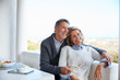 © Ryan Lees/Caia Image - Smiling senior couple relaxing on patio