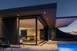 © Martin Barraud/Caia Image - Illuminated modern home showcase exterior at night