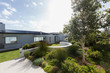 © Martin Barraud/Caia Image - Sunny, tranquil home showcase exterior and landscaping