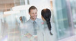 © Tom Merton/Caia Image - Smiling businessman talking to colleague in office