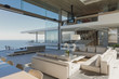 © Tom Merton/Caia Image - Modern, luxury home showcase interior living room with ocean view