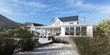 © Martin Barraud/Caia Image - White home showcase exterior beach house