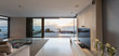 © Martin Barraud/Caia Image - Modern luxury home showcase living room with ocean view