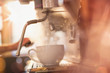 © Tom Merton/Caia Image - Close up espresso machine filling coffee cup with hot water