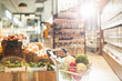 © Tom Merton/Caia Image - Fresh produce in shopping cart in grocery store market