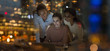 © Tom Merton/Caia Image - Businesswomen working late at laptop in office at night