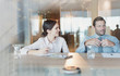 © Tom Merton/Caia Image - Businesswoman listening to businessman in conference room meeting