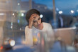 © Tom Merton/Caia Image - Tired businesswoman working late at laptop in office at night