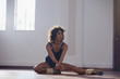 © Sam Edwards/Caia Image - Focused young female dancer practicing in dance studio