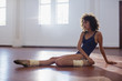 © Sam Edwards/Caia Image - Strong young female dancer stretching leg in dance studio