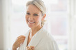 © Sam Edwards/Caia Image - Portrait smiling, confident mature woman in bathrobe