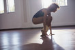 © Sam Edwards/Caia Image - Strong young female dancer stretching toes in dance studio