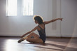 © Sam Edwards/Caia Image - Graceful young female dancer practicing in dance studio