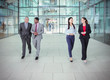© Robert Daly/Caia Image - Business people walking and talking outside modern office building