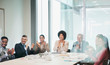 © Robert Daly/Caia Image - Happy, supportive business people clapping in conference room meeting