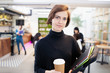 © Sam Edwards/Caia Image - Portrait confident businesswoman with coffee in office