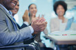 © Robert Daly/Caia Image - Businessman clapping in conference room meeting