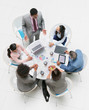 © Robert Daly/Caia Image - High angle view businessman leading meeting at round table