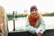 © Paul Bradbury/Caia Image - Portrait confident young woman in stocking cap and scarf