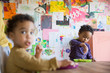 © Sam Edwards/Caia Image - Toddler boy eating breakfast at table