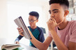 © Sam Edwards/Caia Image - Teenage boy using digital tablet