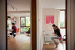© Tom Merton/Caia Image - Couple working in bedroom and home office