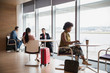 © Robert Daly/Caia Image - Business people working in airport business lounge