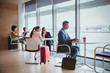 © Robert Daly/Caia Image - Business people working in airport business lounge