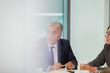 © Robert Daly/Caia Image - Attentive senior businessman listening in conference room meeting