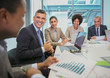 © Robert Daly/Caia Image - Smiling business people in conference room meeting