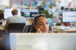 © Tom Merton/Caia Image - Thoughtful, serene businesswoman at computer in office